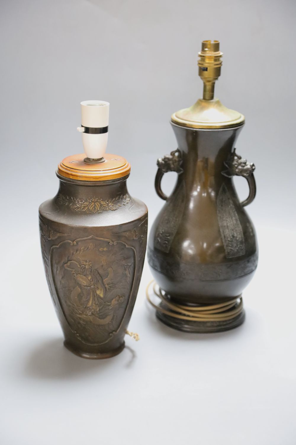 A Japanese bronze vase, late 19th century, later mounted as a lamp and a similar bronzed finished lamp